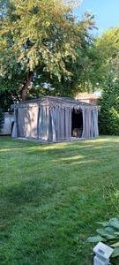 view of outdoor structure with a lawn