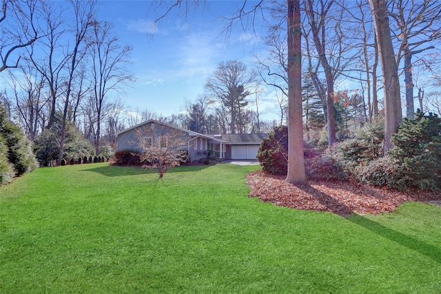 view of yard with a garage