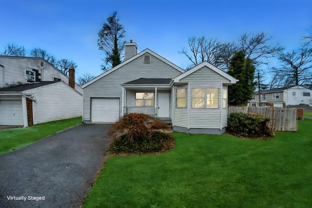 bungalow-style house featuring a garage and a front yard