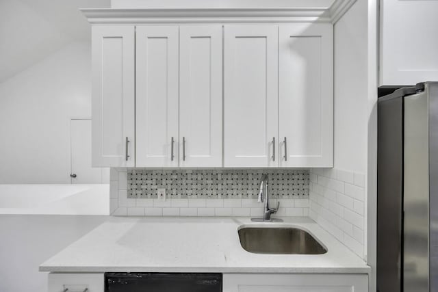 kitchen with white cabinetry, dishwasher, and sink