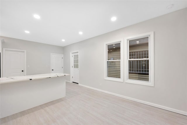 empty room with light hardwood / wood-style floors