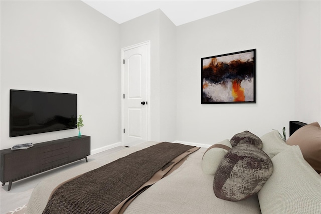 bedroom featuring light colored carpet