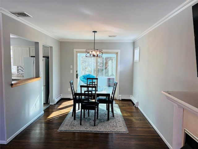 dining space featuring crown molding, dark hardwood / wood-style floors, a chandelier, and baseboard heating