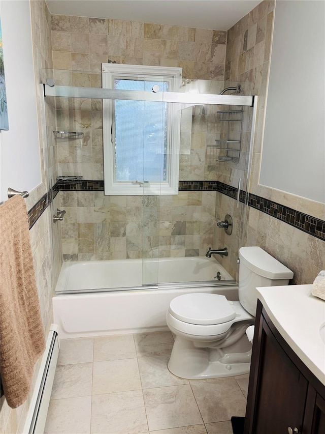 full bathroom featuring toilet, tile walls, vanity, enclosed tub / shower combo, and a baseboard heating unit