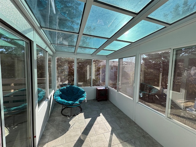 unfurnished sunroom with lofted ceiling