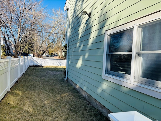 view of property exterior with a yard