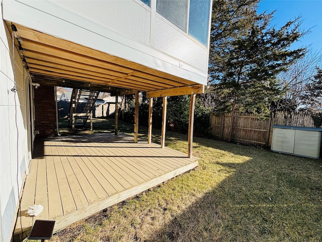 wooden deck with a lawn