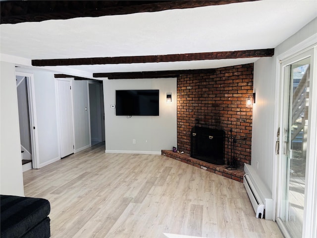 unfurnished living room featuring a baseboard heating unit, beamed ceiling, light hardwood / wood-style floors, and a brick fireplace