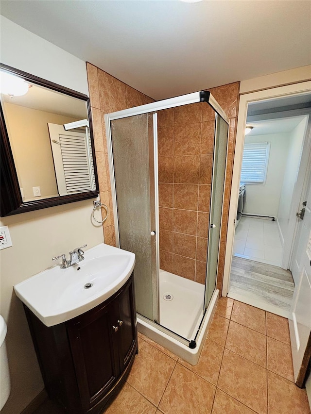 bathroom with tile patterned flooring, vanity, and a shower with shower door