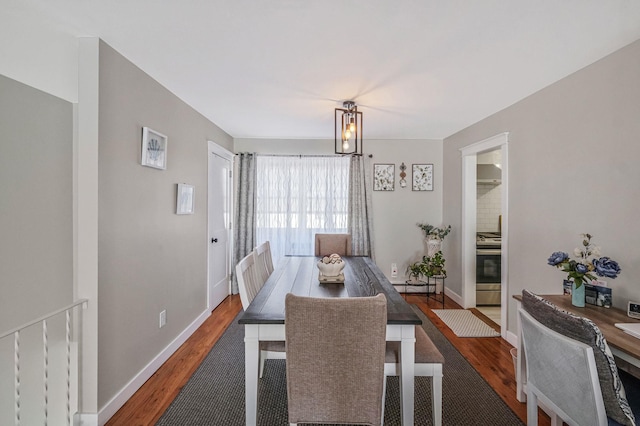 dining room with dark hardwood / wood-style floors