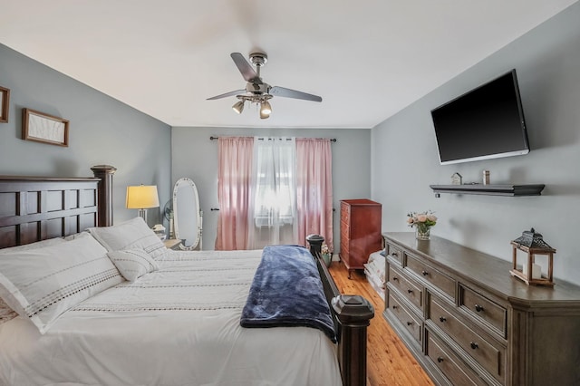 bedroom with ceiling fan and light hardwood / wood-style flooring