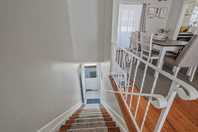 stairway featuring hardwood / wood-style flooring