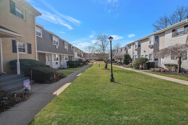 view of community featuring a lawn