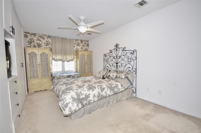 bedroom featuring light colored carpet and ceiling fan