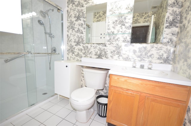 bathroom featuring vanity, toilet, a shower with shower door, and tile patterned flooring