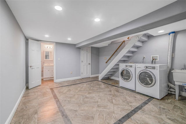 laundry area with washer and dryer and sink