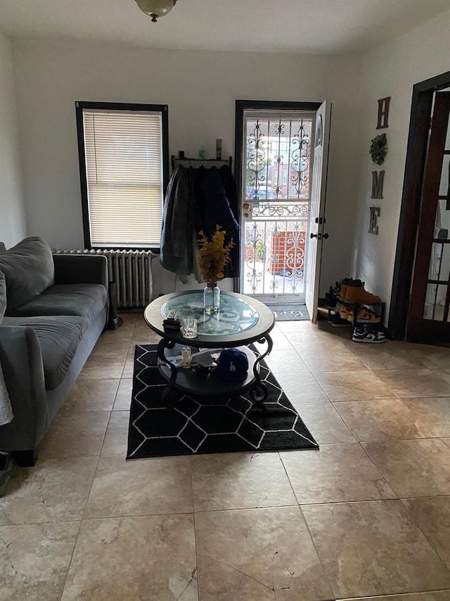 tiled living room with radiator heating unit