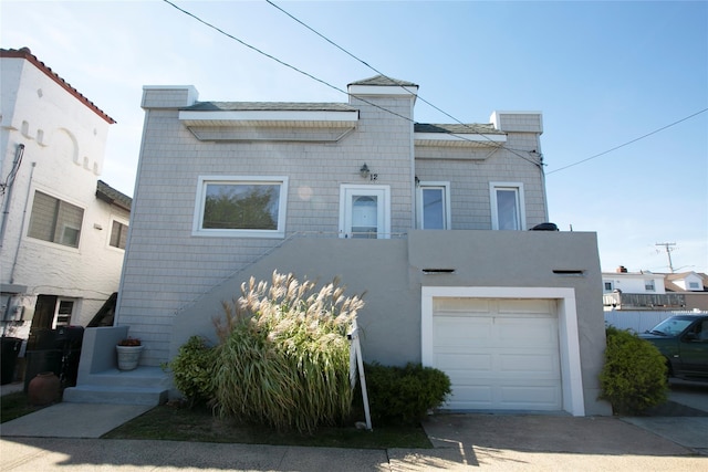 multi unit property featuring a garage