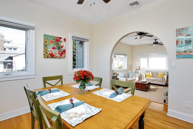 dining space featuring light hardwood / wood-style flooring and ceiling fan