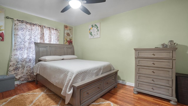 bedroom featuring ceiling fan and light hardwood / wood-style flooring