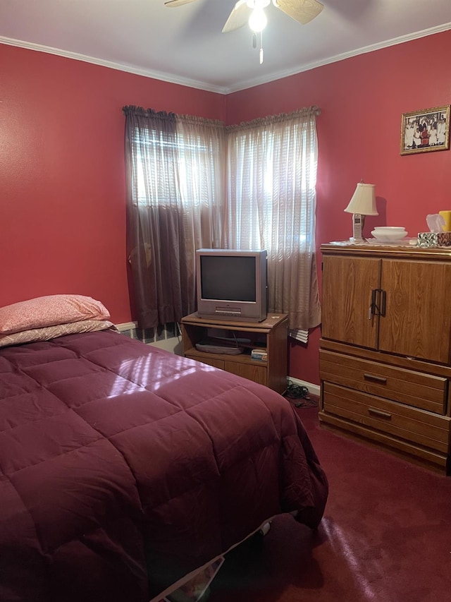 carpeted bedroom with crown molding and ceiling fan