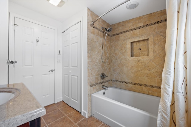 bathroom featuring tile patterned flooring, vanity, and shower / bath combo with shower curtain