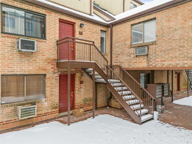 view of snow covered property entrance