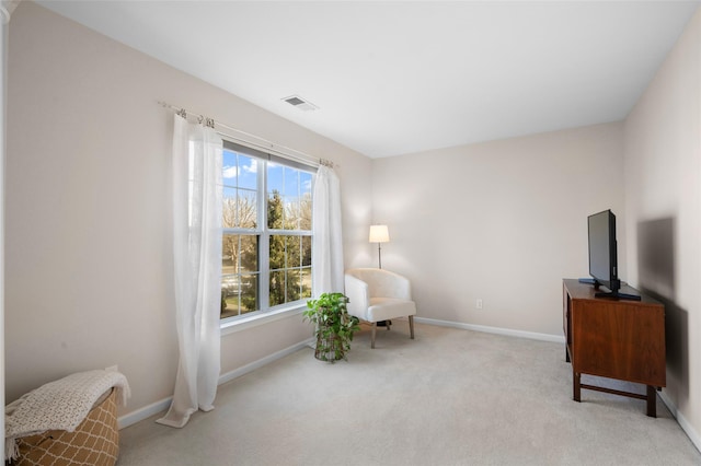 sitting room with light colored carpet