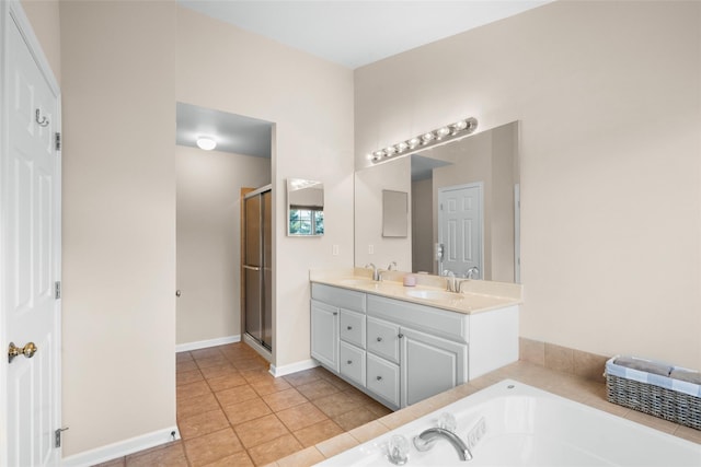 bathroom featuring vanity, shower with separate bathtub, and tile patterned flooring