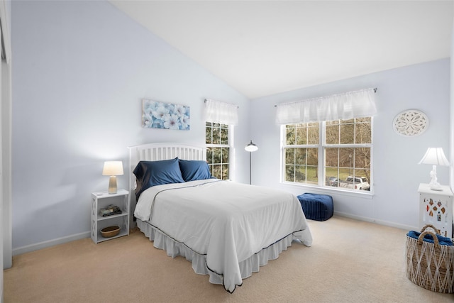 carpeted bedroom featuring vaulted ceiling