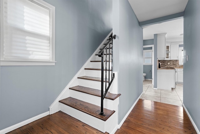 stairway with wood-type flooring