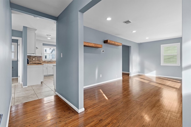 unfurnished living room featuring light hardwood / wood-style floors