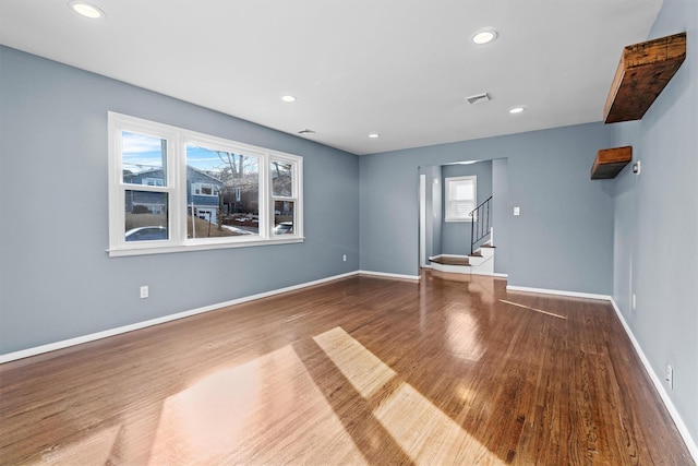 unfurnished living room with hardwood / wood-style flooring