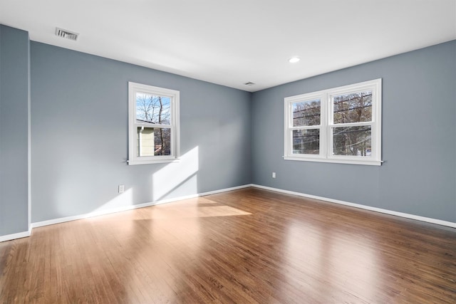 empty room featuring wood-type flooring