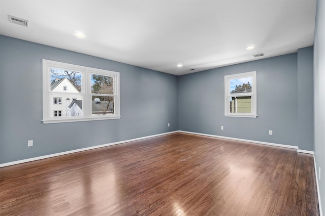 spare room featuring hardwood / wood-style floors