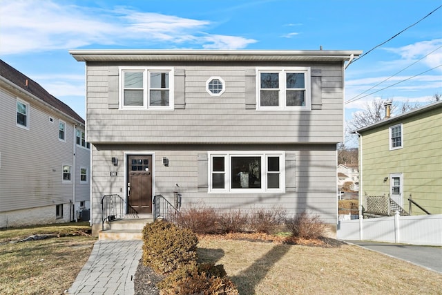 front facade featuring a front lawn