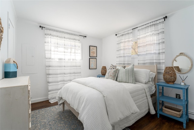 bedroom with dark hardwood / wood-style flooring