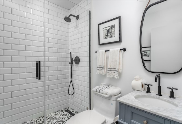 bathroom with vanity, toilet, and walk in shower