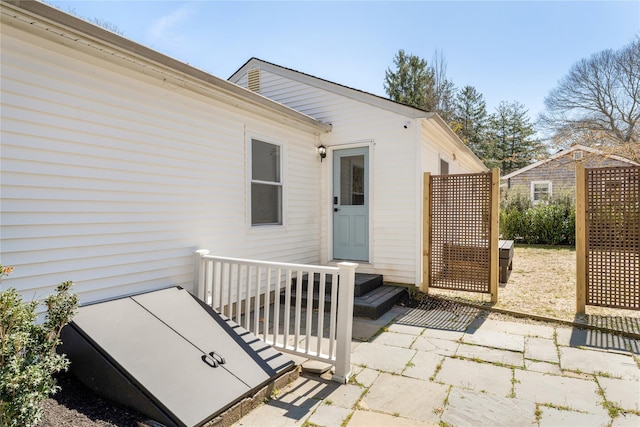 property entrance featuring a patio