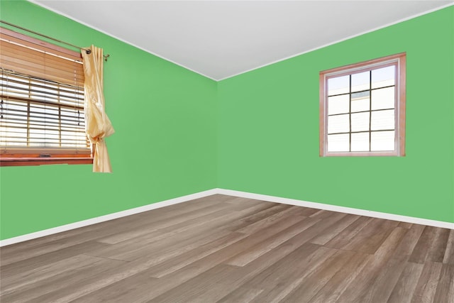 unfurnished room featuring hardwood / wood-style floors