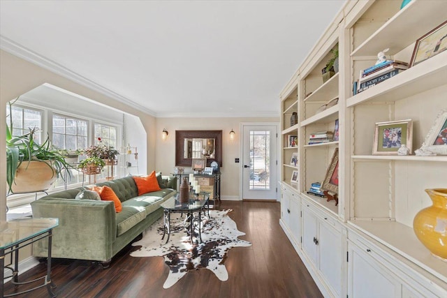 living area featuring ornamental molding, baseboards, and dark wood-style floors