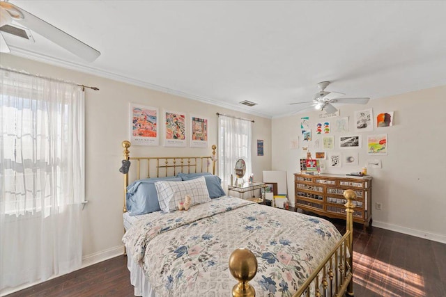 bedroom featuring baseboards, dark wood-type flooring, visible vents, and crown molding