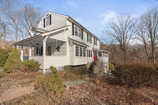 view of property exterior with covered porch