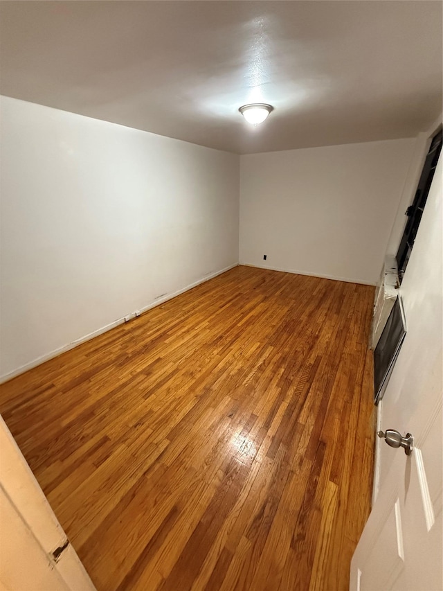 empty room featuring hardwood / wood-style floors