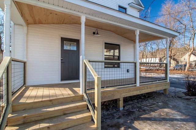 property entrance with covered porch