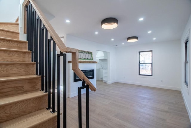 staircase featuring hardwood / wood-style floors