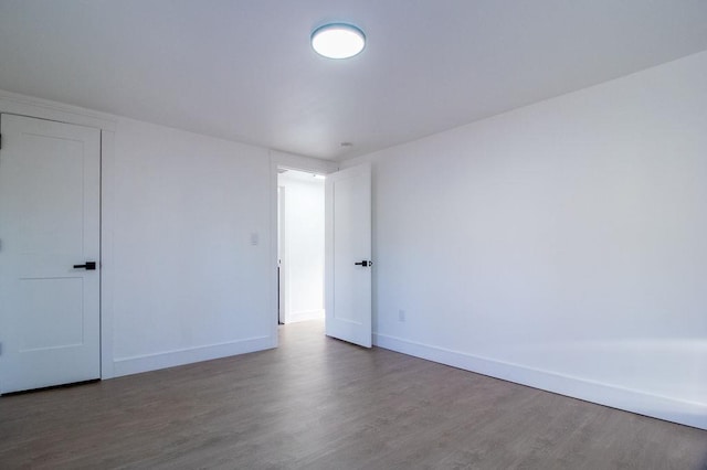 spare room with hardwood / wood-style floors