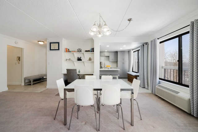 dining room with ornamental molding, light carpet, and a notable chandelier