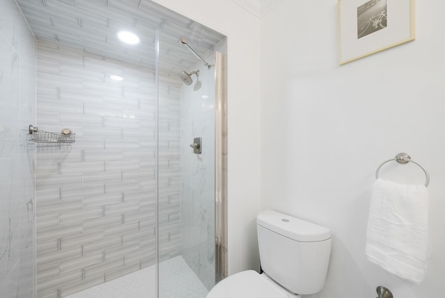 bathroom with an enclosed shower and toilet