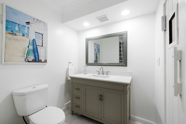 bathroom featuring vanity and toilet